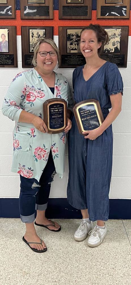 Maggie Platt & Megan Shein-Duncan holding their awards for Teacher of the Year